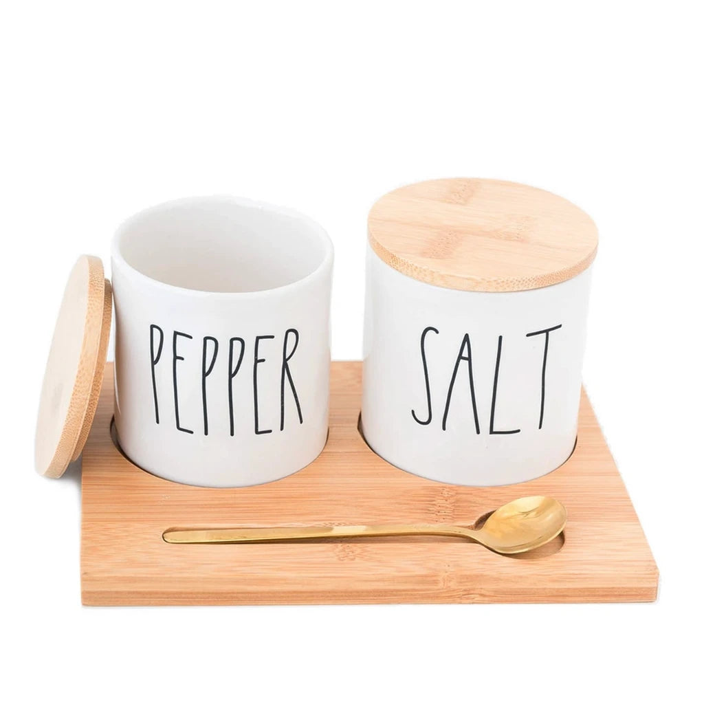 Rae Dunn salt and pepper shakers on bamboo tray