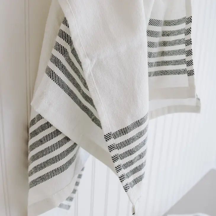 Cream striped tea towel with 5 black stripes